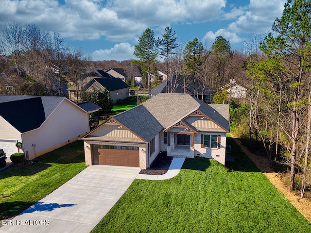 view of front of property with a front yard and a garage