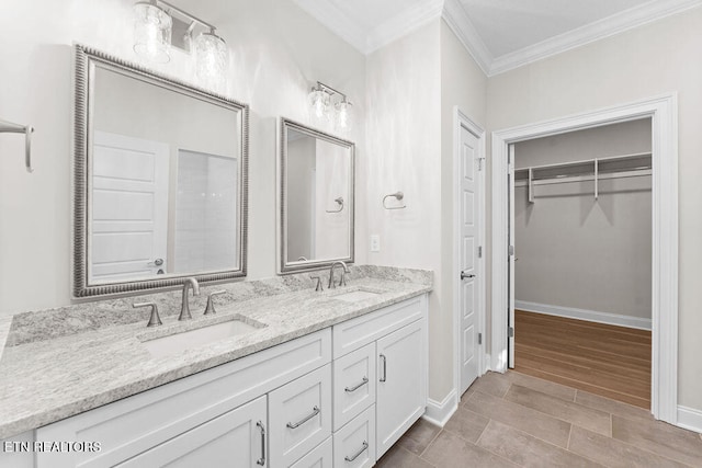 bathroom featuring vanity and ornamental molding