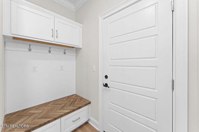 mudroom featuring crown molding