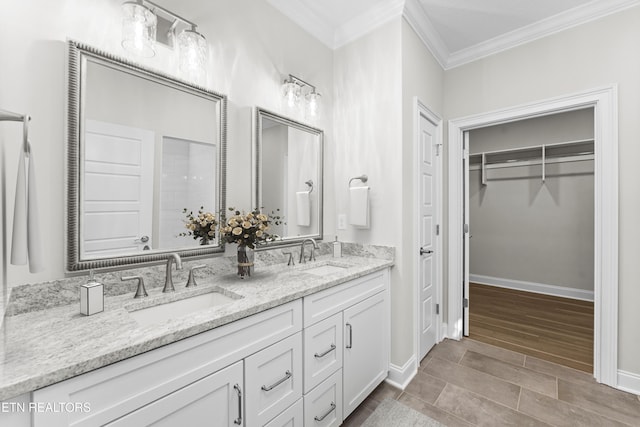 bathroom with vanity and ornamental molding