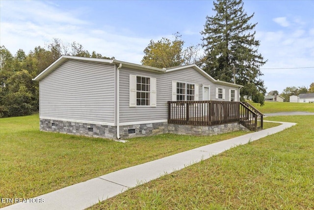 exterior space with a deck and a front lawn