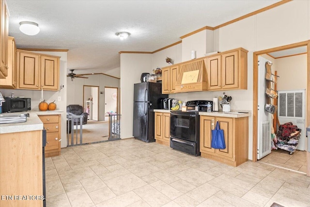 kitchen with ceiling fan, a textured ceiling, black appliances, crown molding, and vaulted ceiling