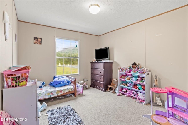 bedroom featuring carpet floors, crown molding, and a textured ceiling