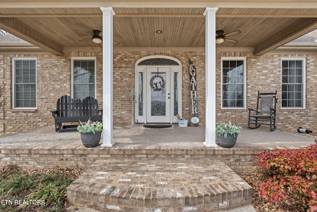 view of exterior entry with ceiling fan