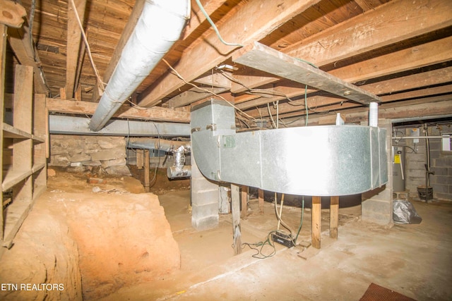 basement featuring gas water heater