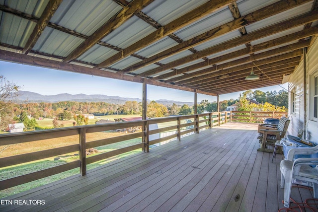 wooden terrace featuring a mountain view