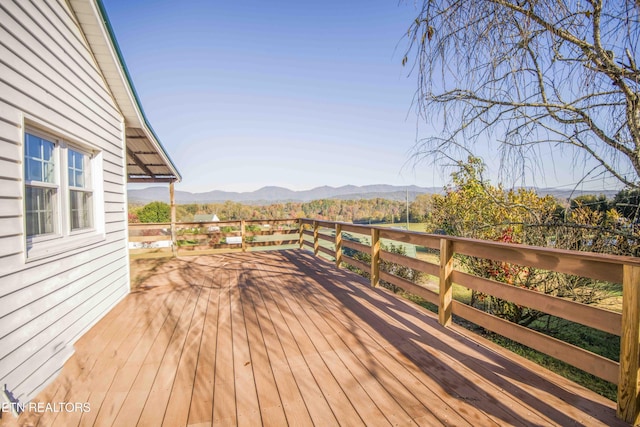 wooden terrace with a mountain view