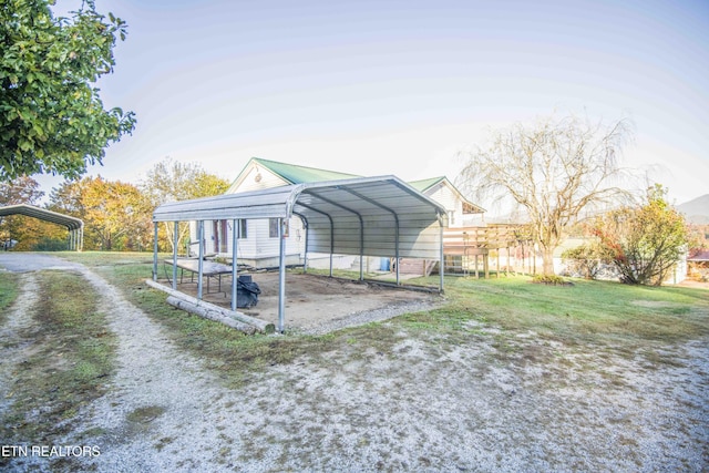 exterior space with driveway and a carport