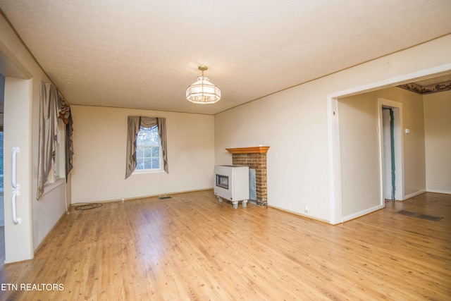 unfurnished living room with wood finished floors