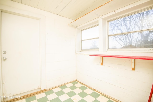 spare room featuring light floors