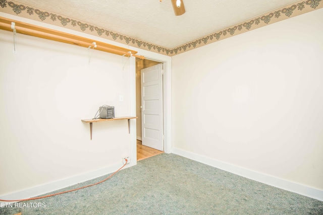 unfurnished room with baseboards, light carpet, and a textured ceiling