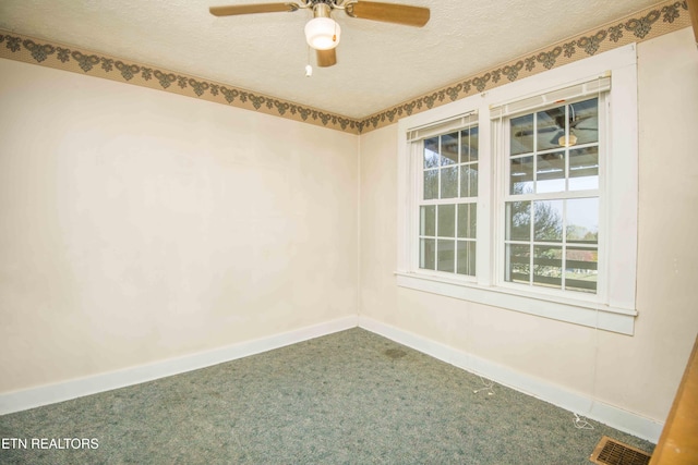 unfurnished room featuring carpet flooring, a textured ceiling, visible vents, and baseboards