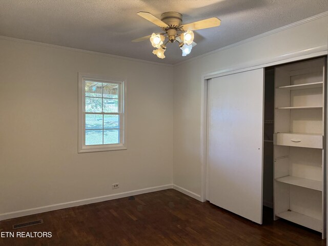 11806 Dry Valley Rd, Loudon, TN 37774 - unfurnished bedroom featuring dark wood-style flooring, ornamental molding, a closet, baseboards, and a ceiling fan