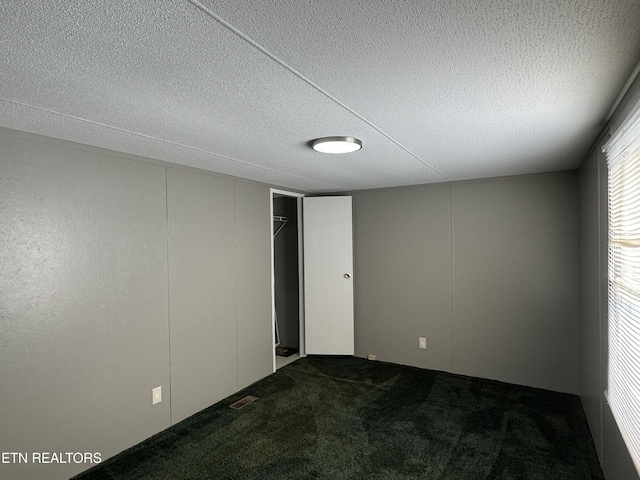 11806 Dry Valley Rd, Loudon, TN 37774 - unfurnished room with carpet flooring and a textured ceiling