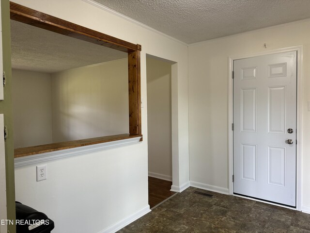11806 Dry Valley Rd, Loudon, TN 37774 - hallway featuring a textured ceiling and baseboards