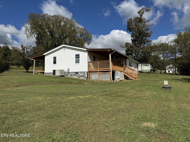 11806 Dry Valley Rd, Loudon, TN 37774 - back of property featuring crawl space, a lawn, a deck, and central air condition unit