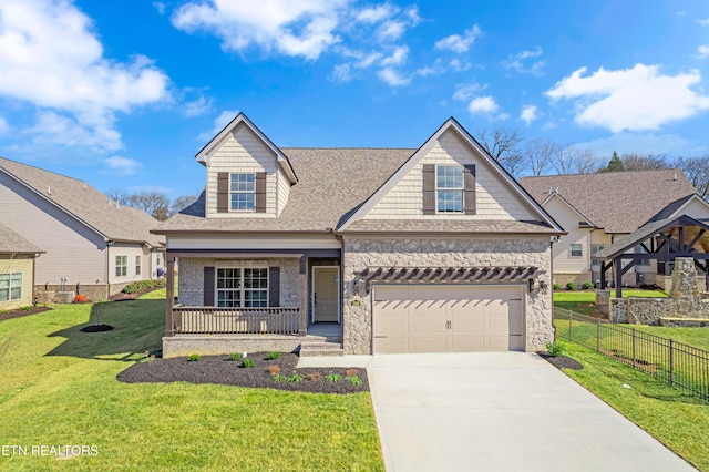 view of front of home featuring a porch, a gazebo, a garage, and a front yard