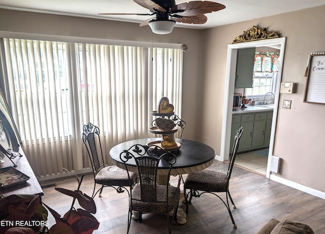 dining area featuring ceiling fan and light hardwood / wood-style floors