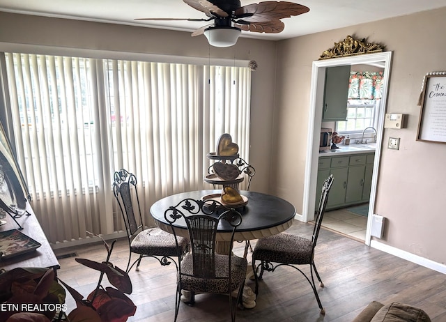 1005 Monroe St, Sweetwater, TN 37874 - dining room with ceiling fan, baseboards, and light wood-style flooring