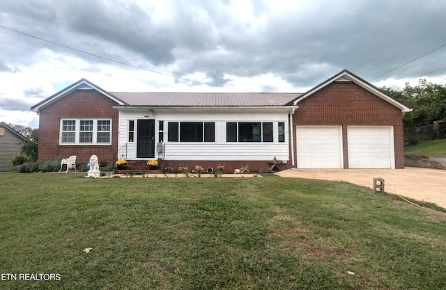 ranch-style home featuring a garage and a front lawn