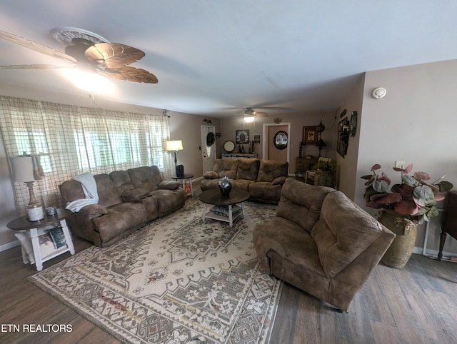 living room featuring ceiling fan and hardwood / wood-style floors