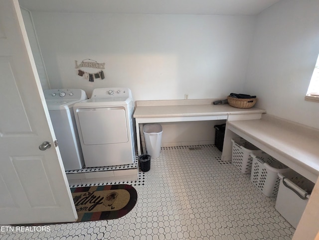 clothes washing area featuring washer and dryer