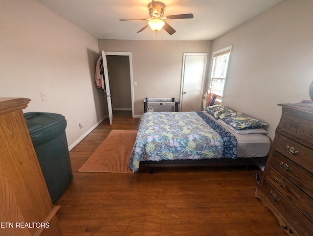 bedroom featuring dark wood-type flooring and ceiling fan