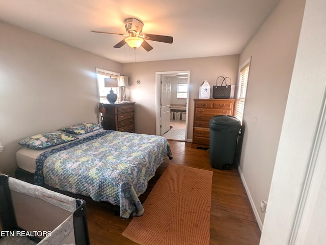 bedroom featuring ceiling fan, ensuite bathroom, and hardwood / wood-style floors