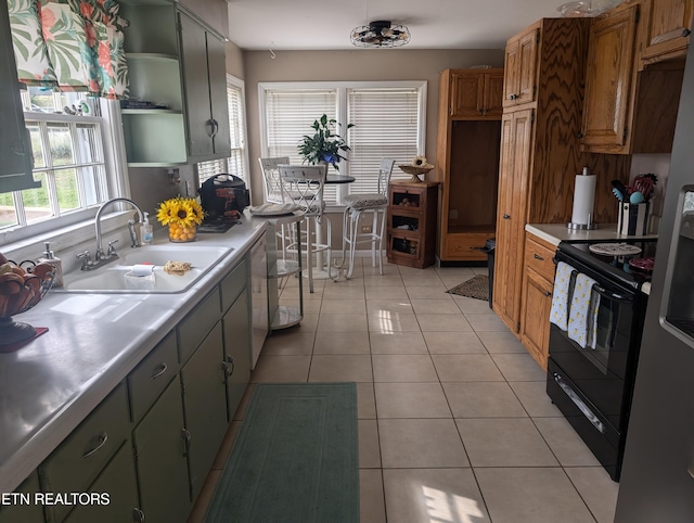 kitchen featuring light tile patterned flooring, dishwasher, sink, and black electric range