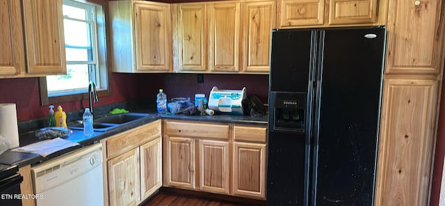 kitchen with white dishwasher, sink, black fridge, and dark hardwood / wood-style flooring