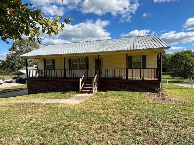 view of front of home featuring a front yard and a porch