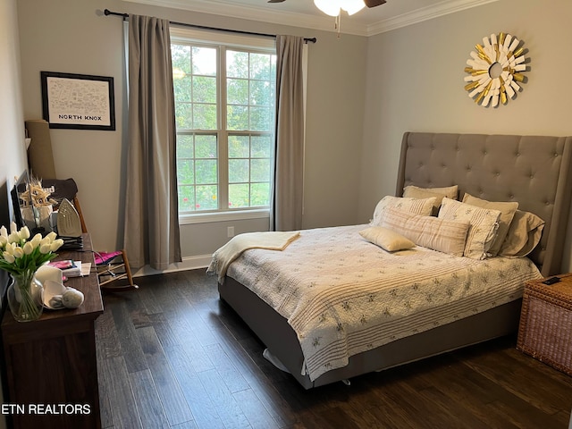 bedroom featuring ceiling fan, ornamental molding, and dark hardwood / wood-style flooring