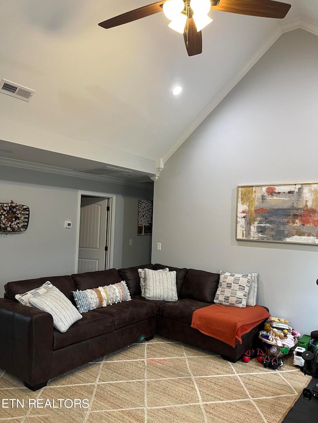 living room featuring ornamental molding, ceiling fan, and vaulted ceiling