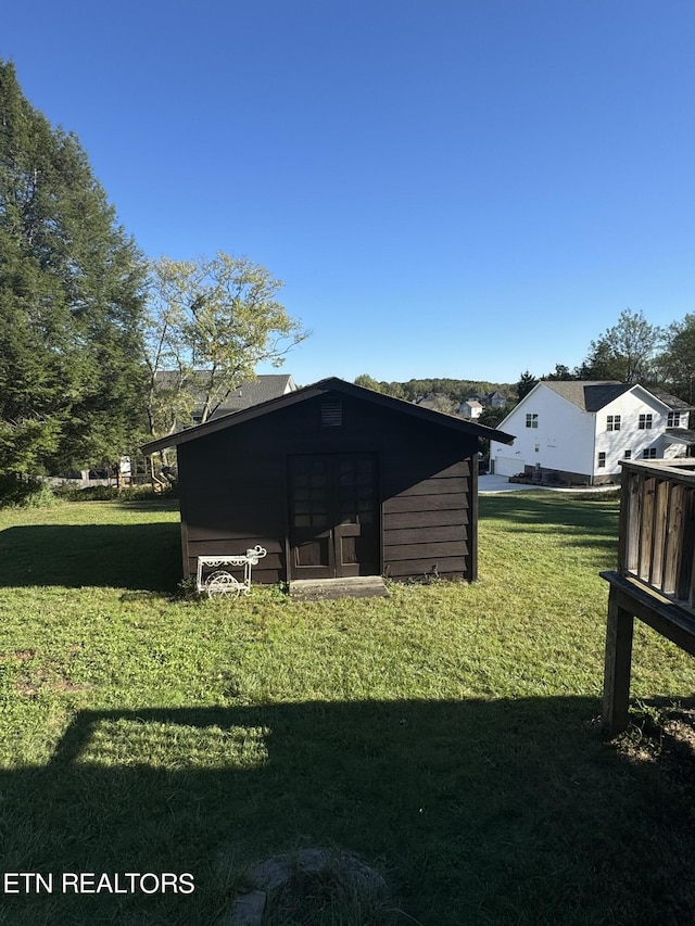 view of outdoor structure with a yard