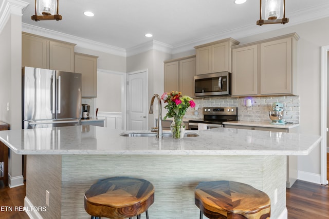 kitchen featuring decorative light fixtures, stainless steel appliances, sink, and dark hardwood / wood-style flooring