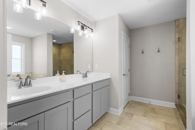 bathroom with vanity, tile patterned floors, and an enclosed shower