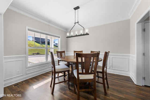 dining area with crown molding, a notable chandelier, and dark hardwood / wood-style flooring