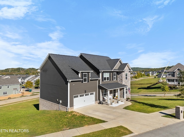 view of front facade featuring a front lawn and a garage