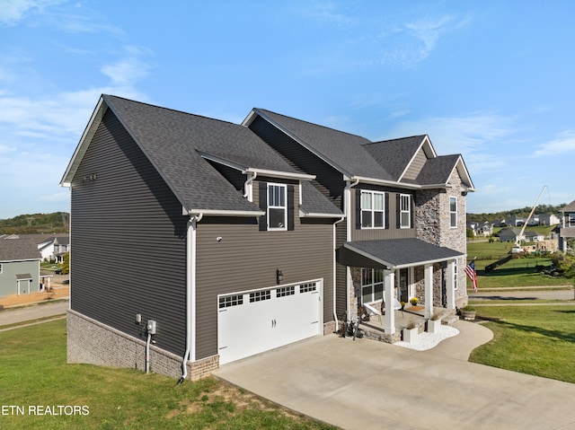 view of side of home featuring a garage and a lawn