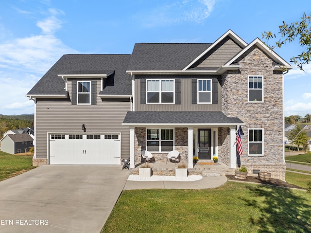 craftsman-style house with a front lawn and a garage