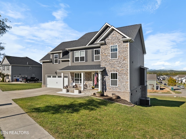 view of front of house with cooling unit, a front lawn, and a garage