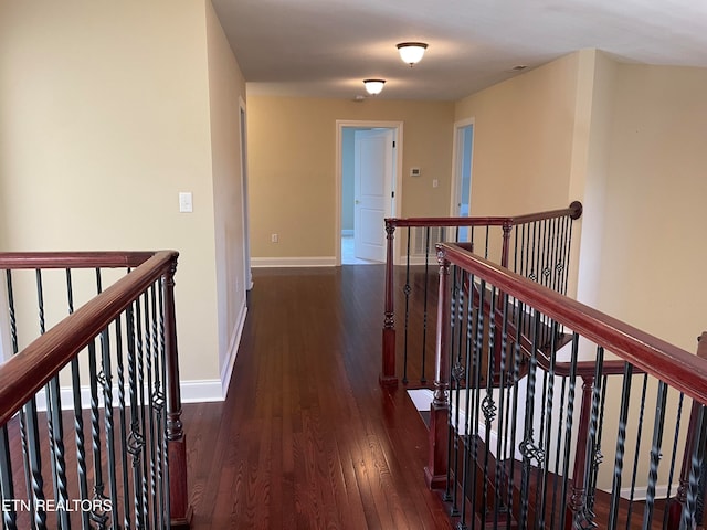 hall featuring dark wood-type flooring