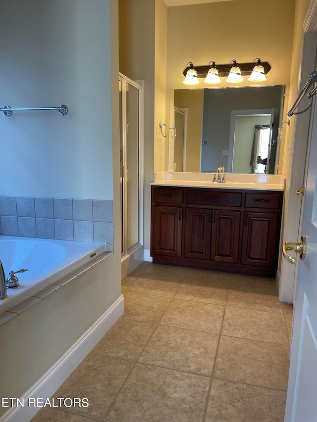 bathroom with vanity, tile patterned floors, and plus walk in shower