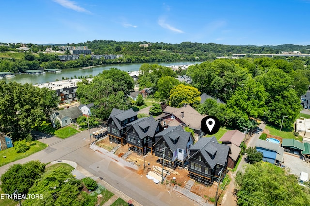 birds eye view of property featuring a water view