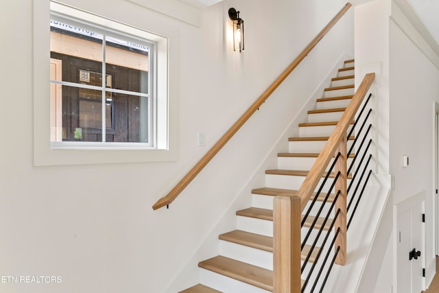 staircase with plenty of natural light