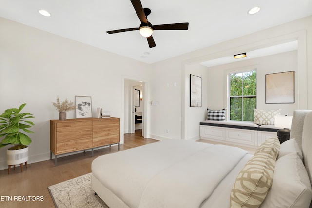 bedroom featuring dark wood-type flooring and ceiling fan