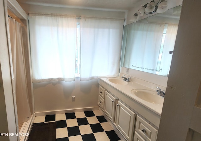 bathroom featuring vanity and walk in shower