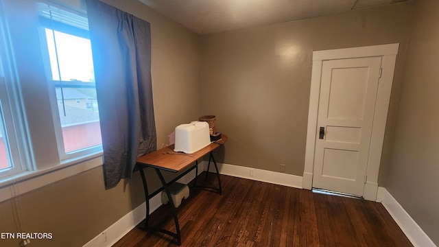 unfurnished office with dark wood-type flooring