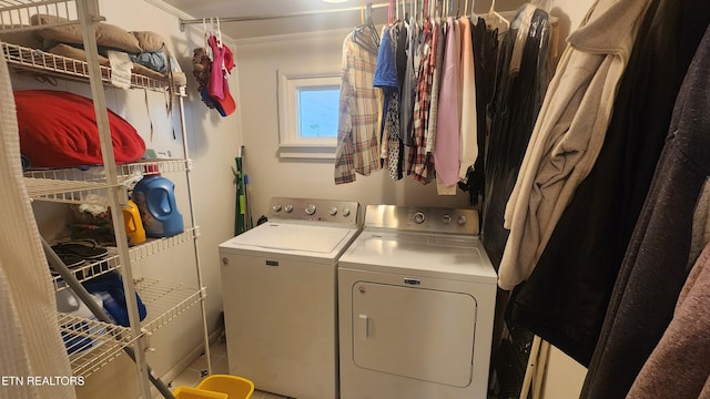 laundry room with ornamental molding and separate washer and dryer