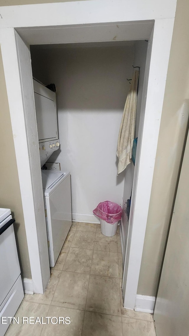 laundry area with stacked washing maching and dryer